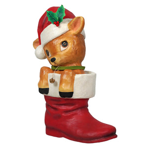 A charming bethany lowe design reenie reindeer figurine in a red christmas stocking with santa hat and holly decor