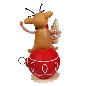 A tan bethany lowe designs christmas reindeer figure with black wire antlers and red bow on a red swirl ornament