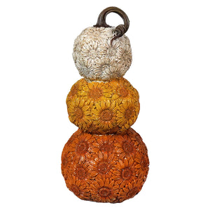 Stack of three decorative pumpkins with floral patterns in white, yellow, and orange colors.