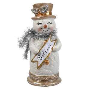 A glittery white resin tinsel snowman figurine wearing a gold top hat holding a believe banner for christmas decor
