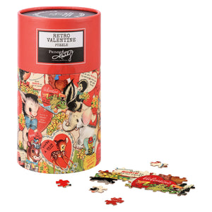 Red cylindrical puzzle container decorated with vintage Valentine’s Day artwork featuring hearts, animals, and retro illustrations.