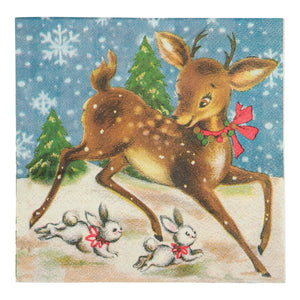 A retro deer beverage napkin with a brown deer and rabbits wearing red bows on a blue snowy pine background