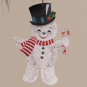 A glittery silver bethany lowe design retro rockin snowman ornament with black top hat holding a candy cane