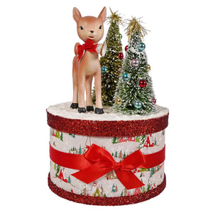 Retro ruby reindeer festive box with tan bethany lowe deer figurine and bottle brush trees in holiday decor