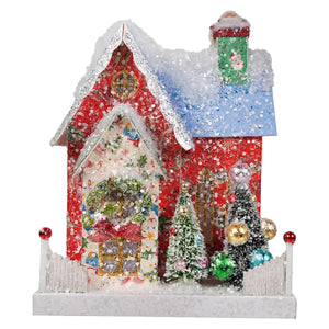 A retro santa adobe christmas house ornament with glittery snow green chimney santa face and cody foster light cord