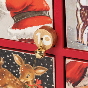 A golden wooden number 10 charm with brass bell from retro santa claus countdown box merry christmas countdown ornament