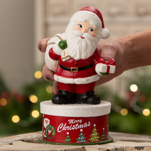 Retro santa figurine by bethany lowe design with glittery hat black boots holding ornament and gift on box