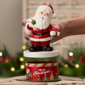 Retro santa bethany lowe design figurine in red and white with glittery beard holding candy cane and wrapped gift