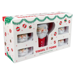 Retro santa pitcher and cups set features ceramic red santa faces with white beards in a festive box