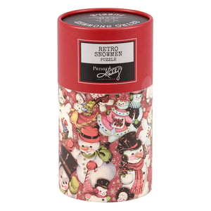 Red cylindrical container holding a 100-piece retro snowmen puzzle by primitives by kathy for fun winter evenings