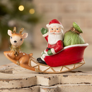 Red and white rocking santa in sleigh figurine with brown resin reindeer and gold antlers from bethany lowe designs folk art santas