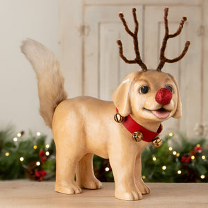 A tan resin rudolph puppy dog figurine by bethany lowe design with brown pipe-cleaner antlers and red glittery nose