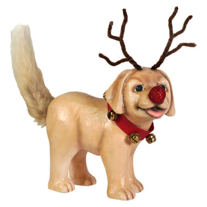 A tan bethany lowe design rudolph puppy figurine with brown pipe-cleaner antlers glittery red nose and gold bell collar