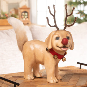 A cheerful tan resin rudolph puppy figurine with brown pipe-cleaner antlers and gold jingle bells by bethany lowe design