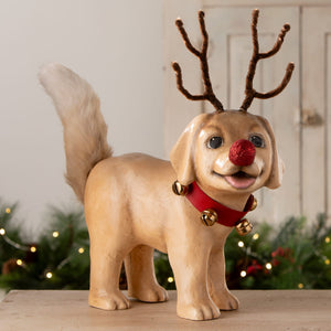 A tan resin rudolph puppy dog figurine by bethany lowe design with brown pipe cleaner antlers and red glittery nose