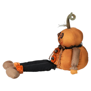 Rustic canvas pumpkin scarecrow doll in orange with stitched face, black pants, and brown boots perfect for fall decor