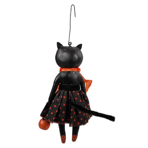 Black cat sabrina kitty ornament with orange polka-dot skirt and scarf holding small pumpkin halloween ornament