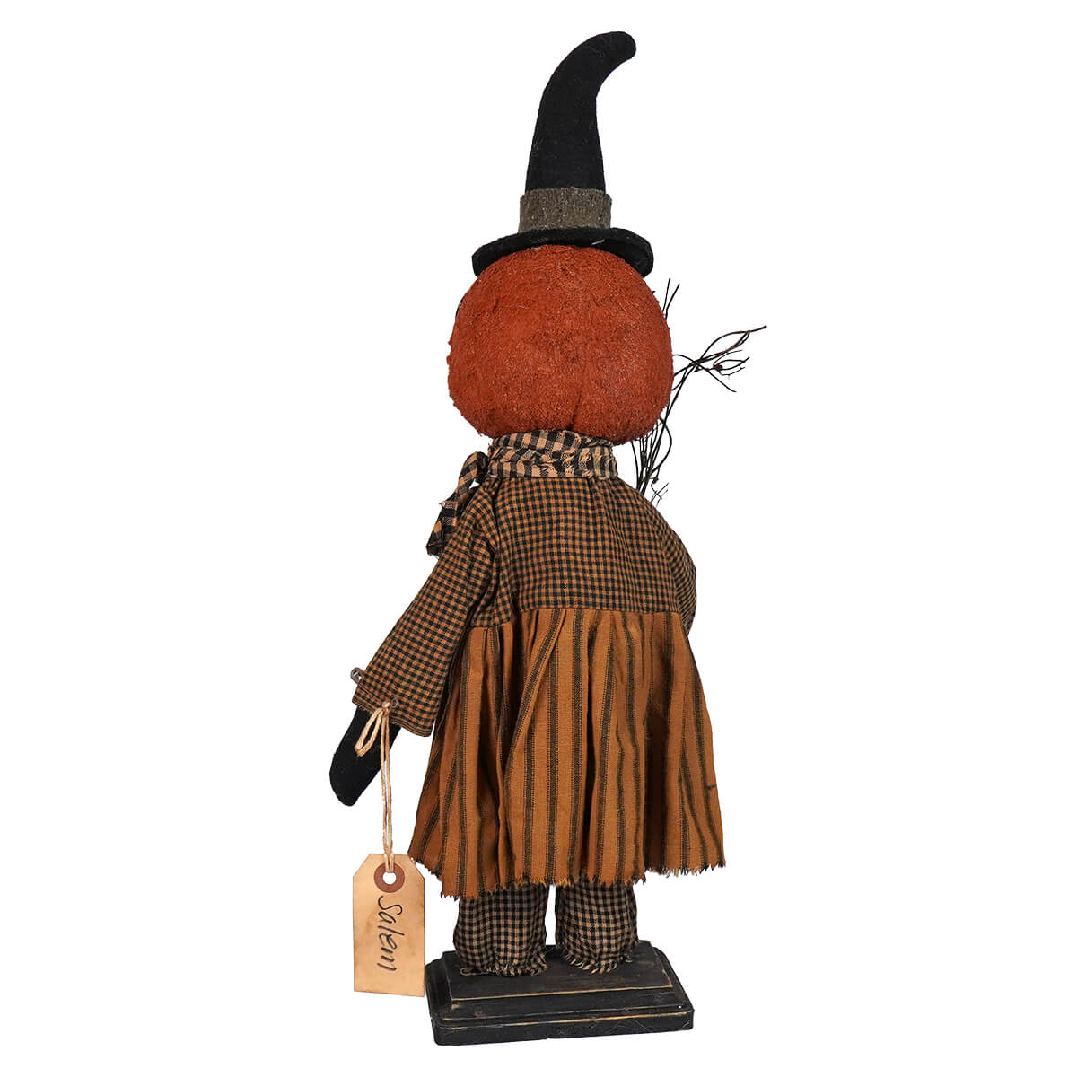 Decorative Halloween witch figure with a pumpkin head and rustic clothing.