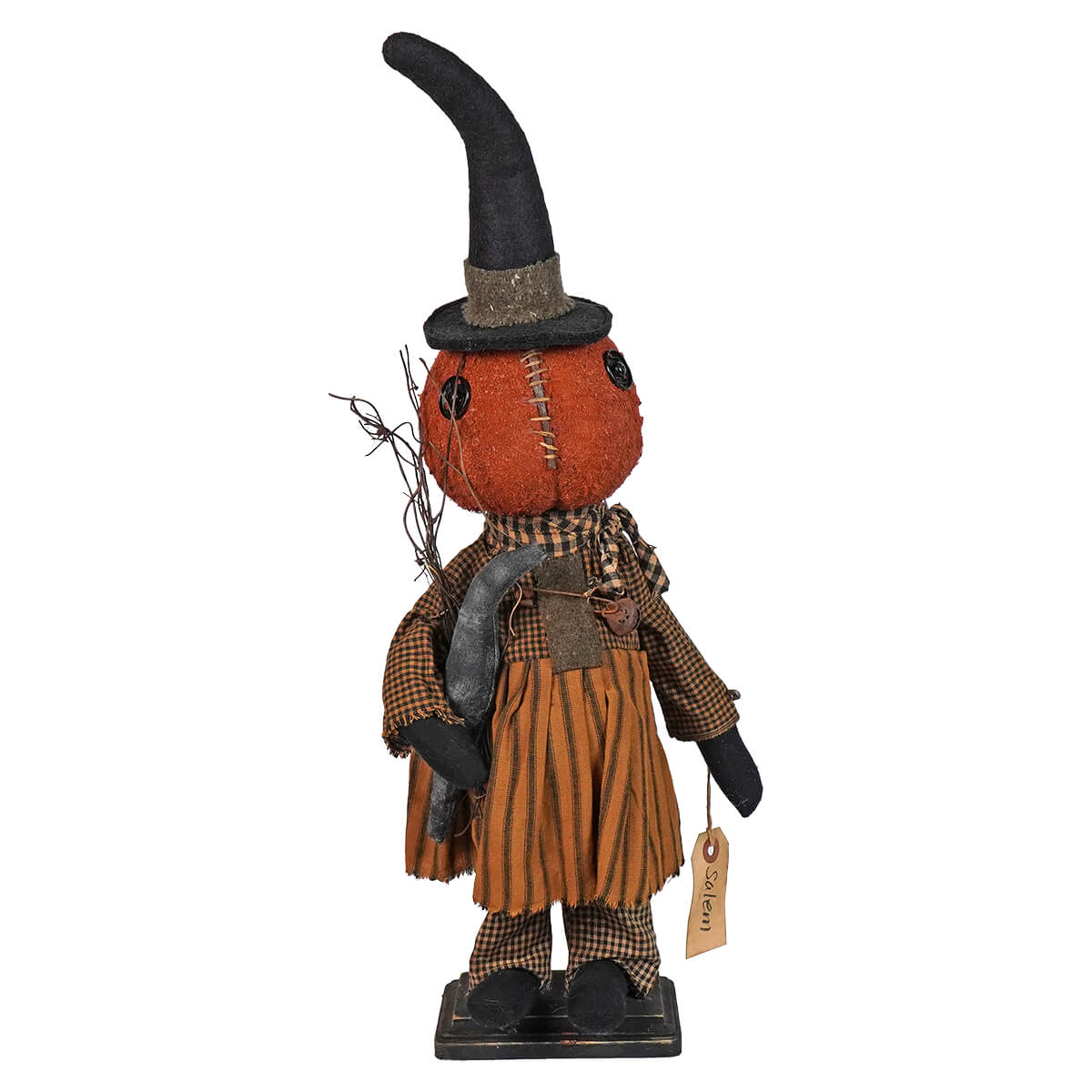 Halloween-themed decorative figure with a pumpkin head wearing a witch’s hat and rustic clothing.