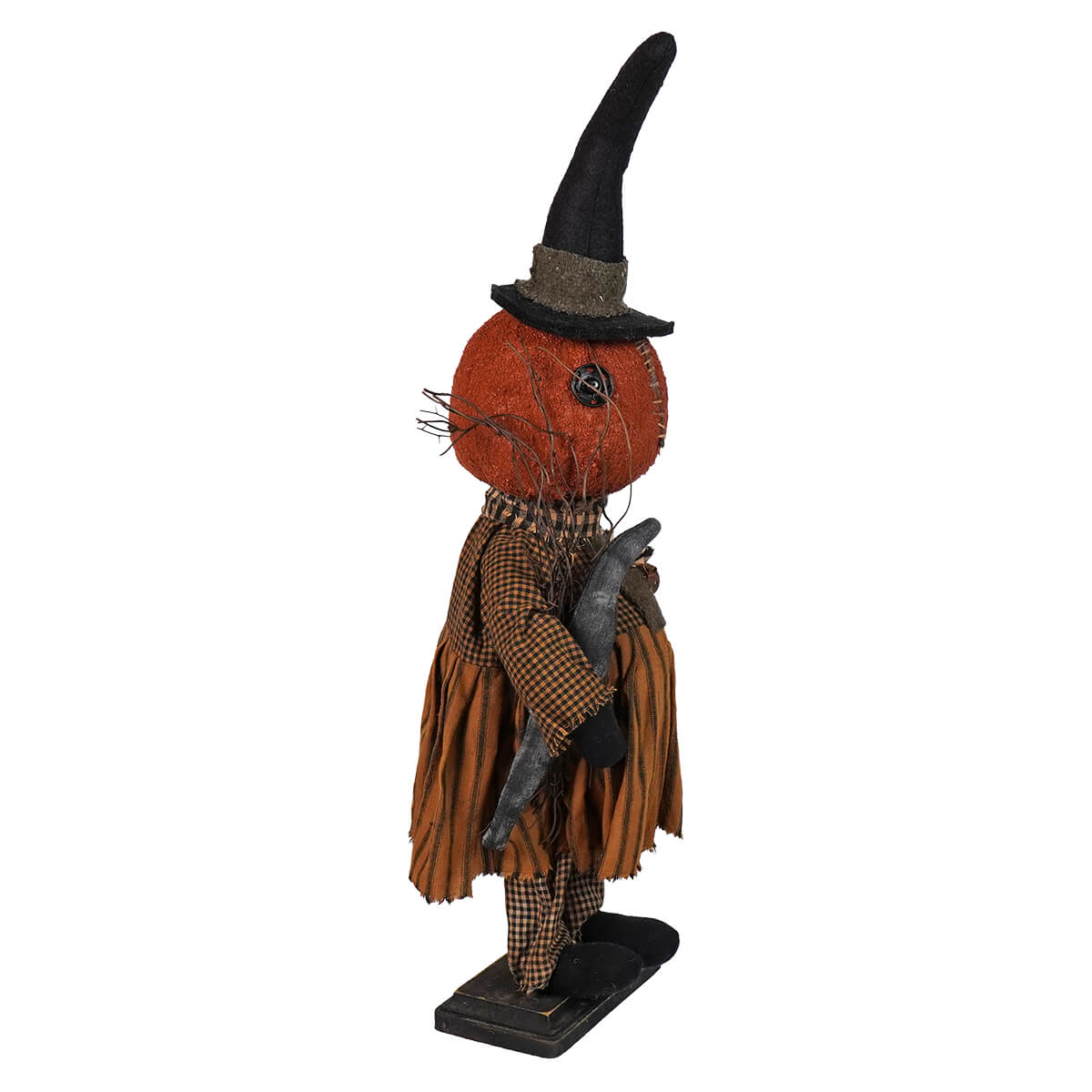 Halloween-themed decorative figure with a pumpkin head wearing a witch hat and tattered clothing.