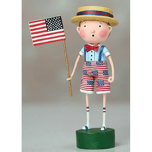 Patriotic figurine wearing a straw hat, bow tie, and American flag-patterned shorts while holding a US flag.