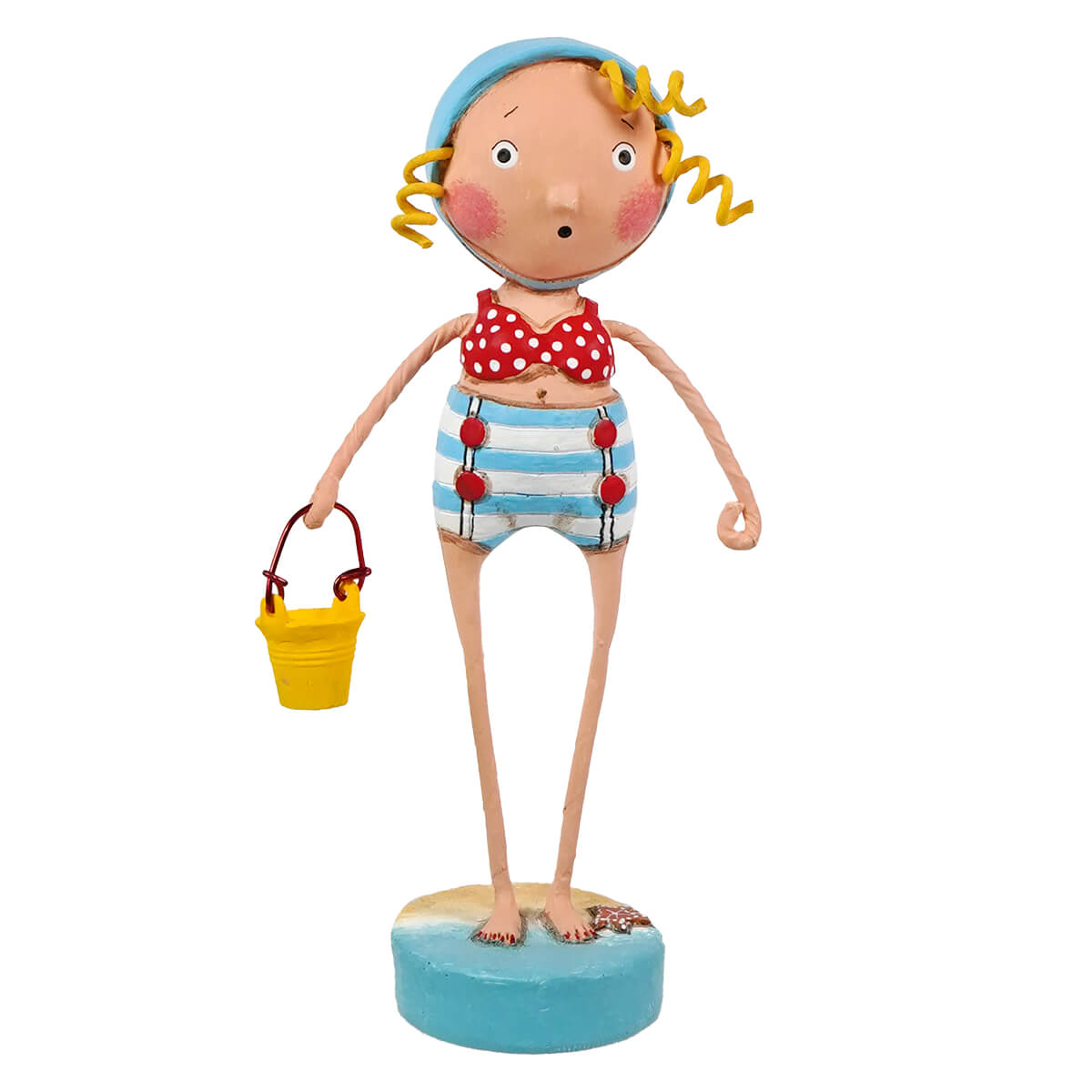 A lori mitchell sandy figurine of a girl with curly yellow hair in red polka-dot bikini and striped shorts holding a bucket