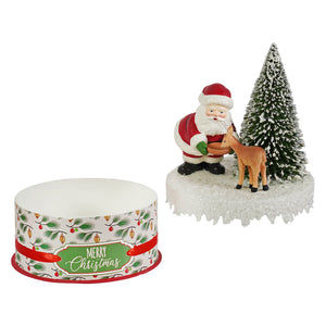 Santa and deer on box featuring red and white santa figure with christmas reindeer figures and frosted pine tree decor