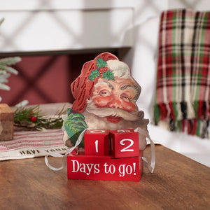 Red wooden santa days to go block countdown with vintage santa face and glittery hat for holiday decor, not snowman block countdown