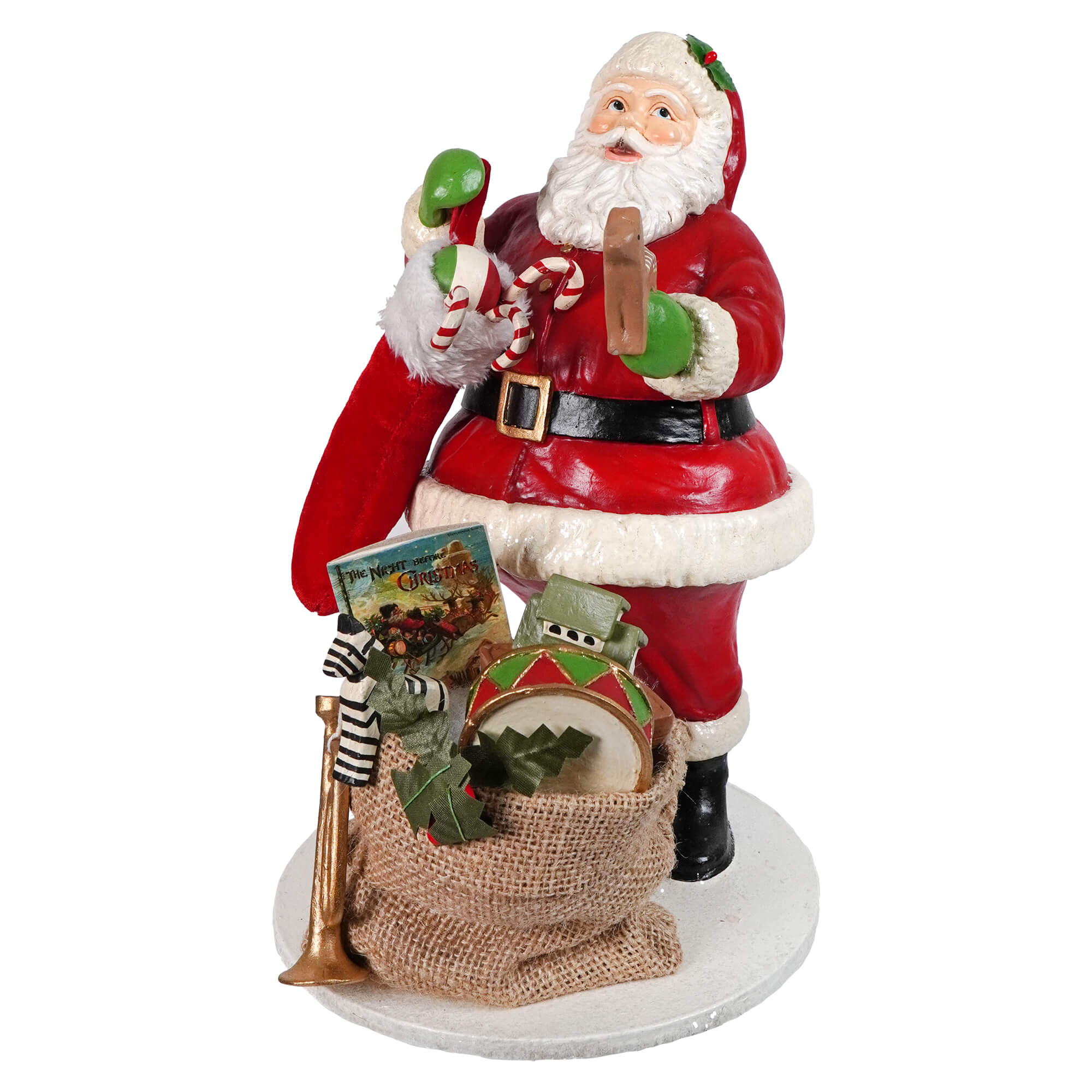 Red and white santa filling the stocking figurine with black belt holding candy canes and green ornaments by bethany lowe designs