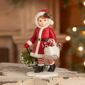 Red and white ceramic santa girl pulling tree figurine holding basket with candy canes by bethany lowe designs