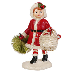 Red and white christmas-themed santa girl pulling tree figurine by bethany lowe designs holding basket and brush