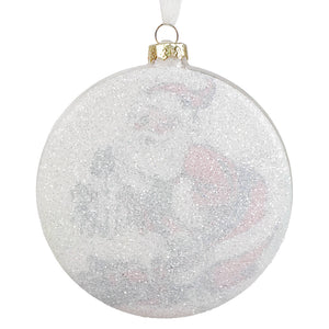 A clear glass disc ornament with glittery silver finish and pink gray snowflakes by bethany lowe santa glass disc ornament
