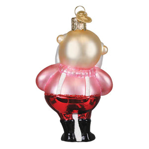 A glossy glass christmas glass ornament shaped like a chubby workshop santa ornament in pink and red dress with black boots