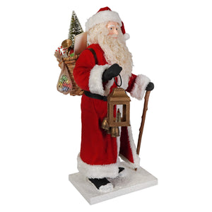 Red and white santa figures by bethany lowe designs with fluffy beard holding ornate lantern and gift basket folk art santas