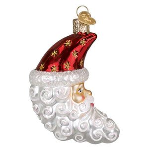 A glossy red and white christmas glass santa ornament with gold star details and a textured silver beard tag