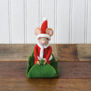 A charming needle-felted merry mouse critter in a red santa outfit sitting on a green felt christmas tree base