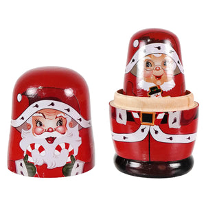 Red wooden nesting dolls featuring santa and mrs claus from the santa mrs claus elves wood nesting doll set by kurt adler