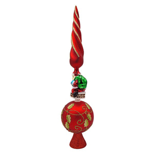 Red glass finial tree topper with gold swirls santa figurine on chimney and holly leaf patterns perfect as santa tree topper