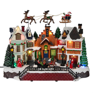 Santa Over Rooftops Lighted Holiday Village Scene