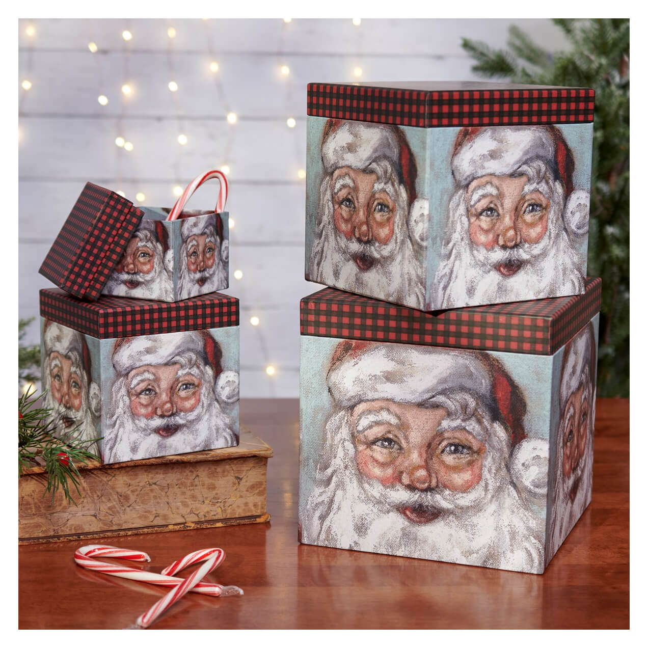 Christmas-themed gift boxes decorated with Santa Claus faces and red plaid trim.