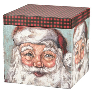 Gift box decorated with a painted portrait of Santa Claus and topped with a red and black plaid pattern.