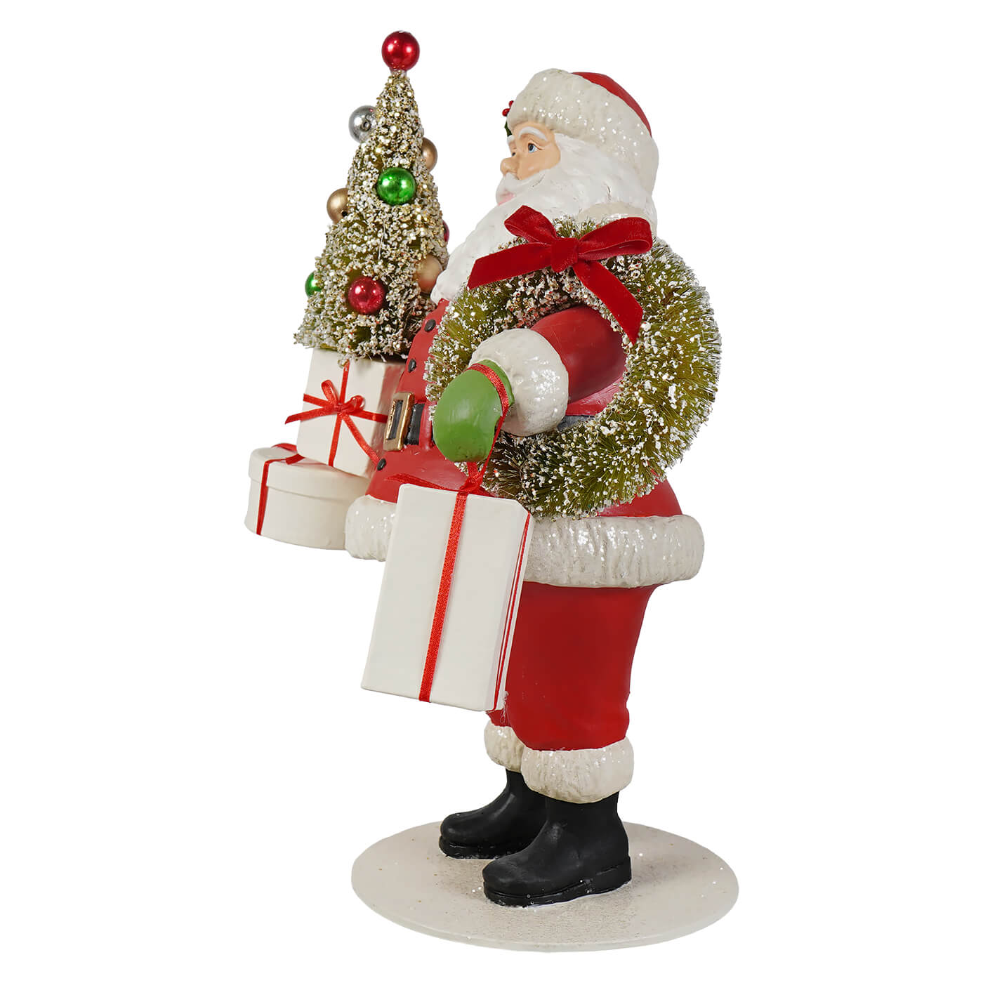 Santa with Christmas presents small santa figurine by bethany lowe designs holding green wreath next to mini tree