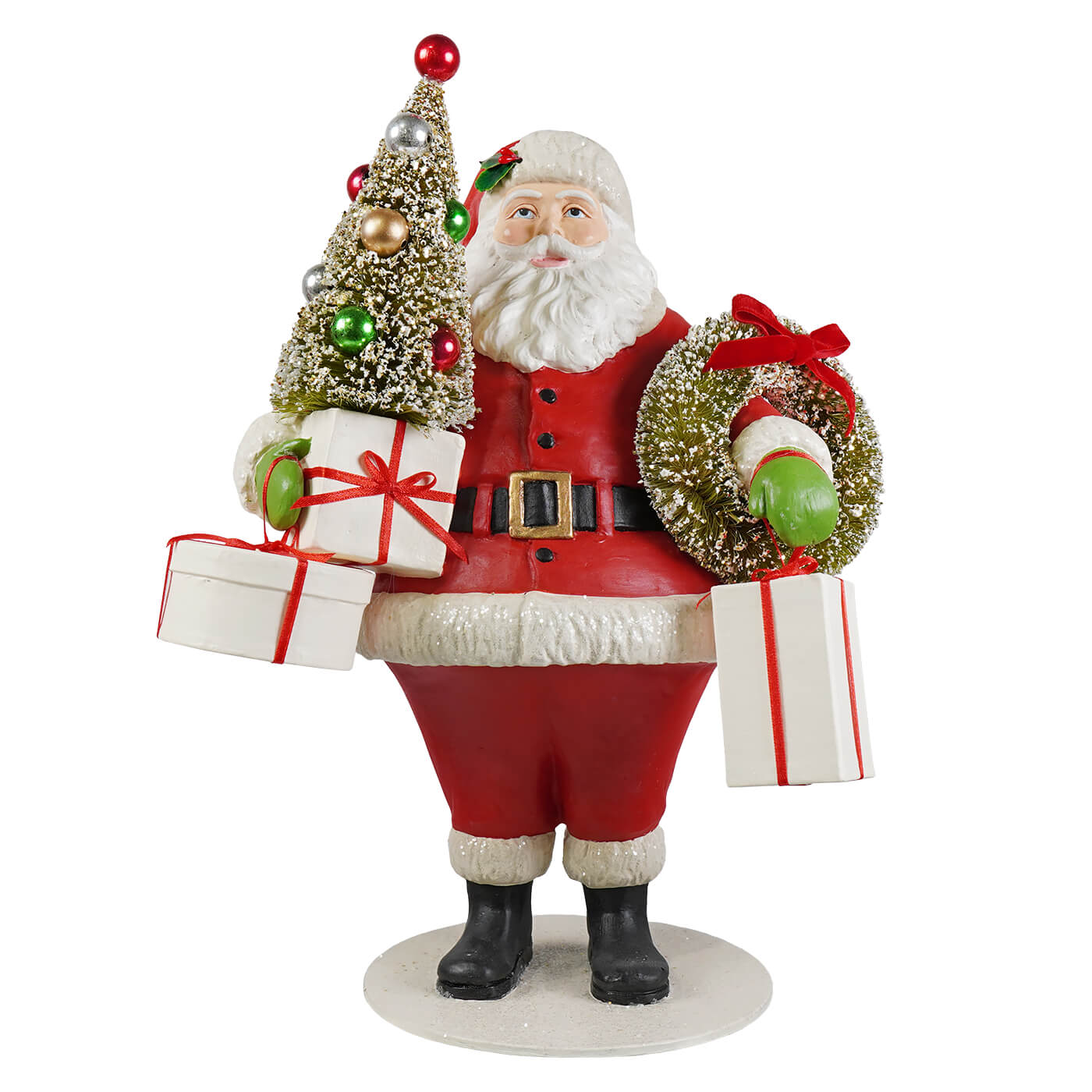 Small santa figurine by bethany lowe designs holding a decorated tree wrapped gifts and a wreath in red and white