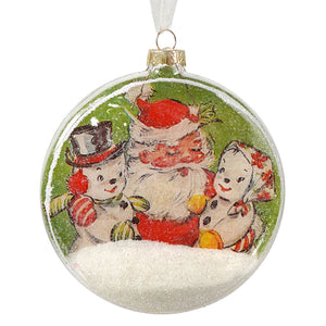 Clear glass disc ornament with vintage santa and two snowmen on green background filled with white faux snow by bethany lowe
