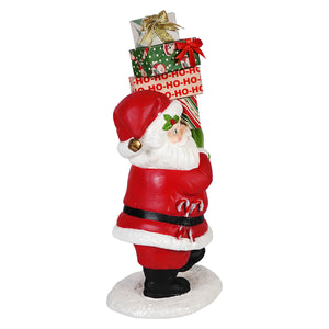 Red and white santa claus figurine carrying festive gift boxes from bethany lowes santa’s delivery collection