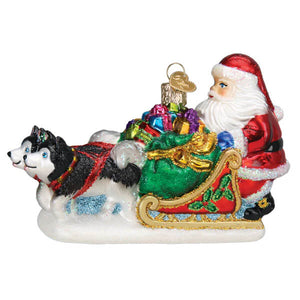 Santa’s dog sled ornament featuring husky dogs and a colorful glass sleigh full of gifts perfect for holiday decor