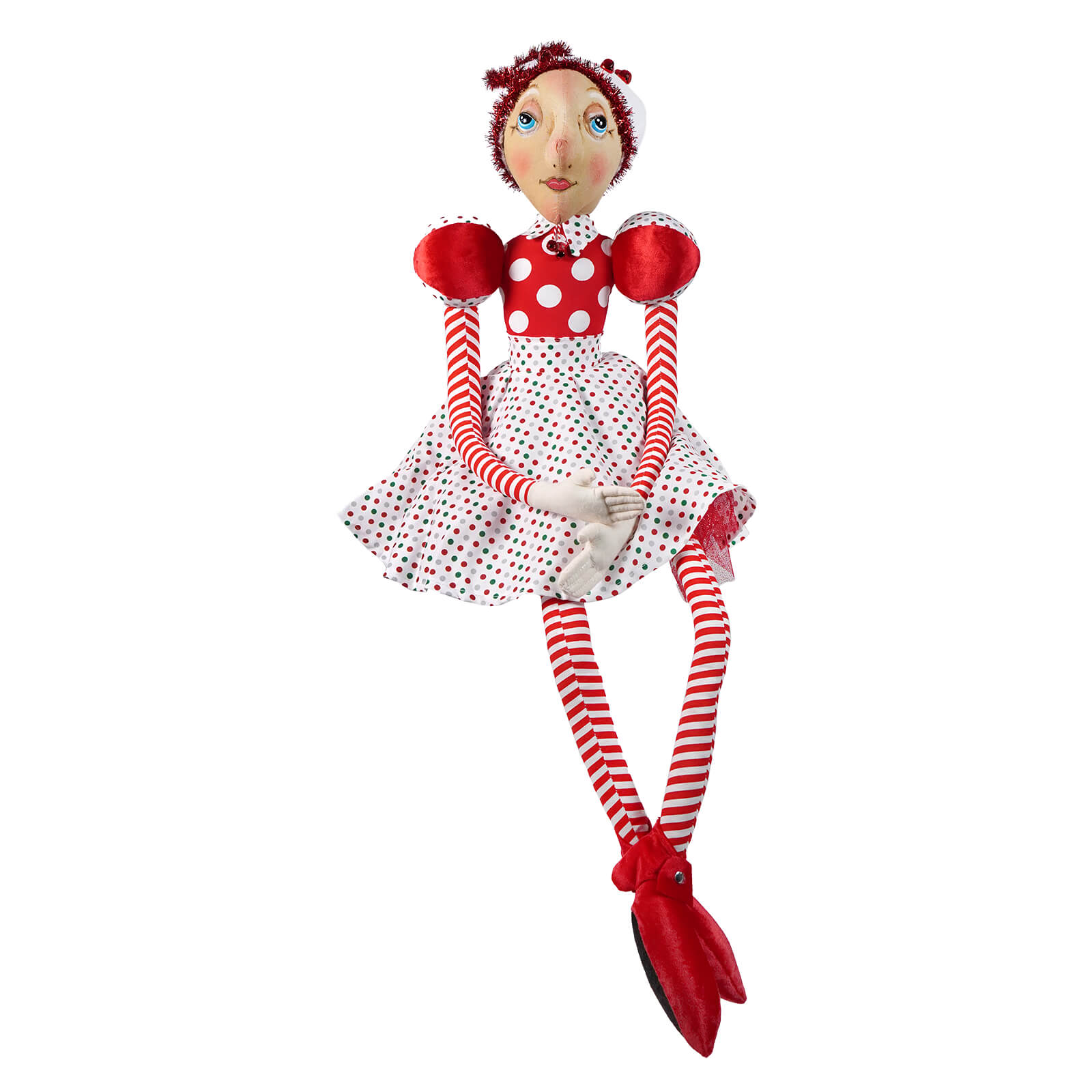 A whimsical red and white polka-dotted sayra doll with striped limbs spreading holiday cheer joe spencer christmas