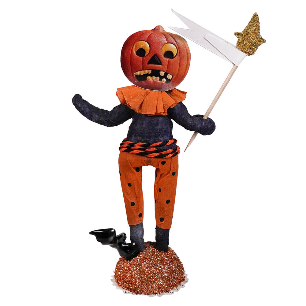 Scared pumpkin figure handcrafted folk art paper mache pumpkin head with black polka-dot pants holding white flag