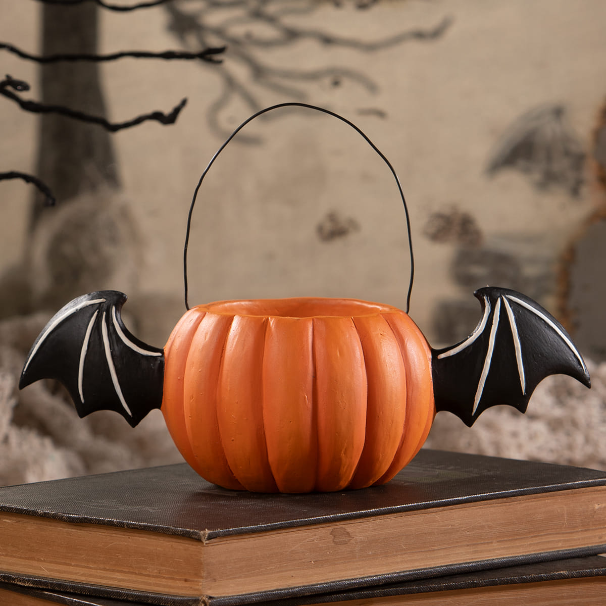 Orange pumpkin-shaped jack bucket with black bat wings and wire handle for halloween pumpkins and gourds fans