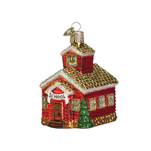 Red glass school house ornament with gold glitter roof trim and green tree figural decor perfect for holiday display